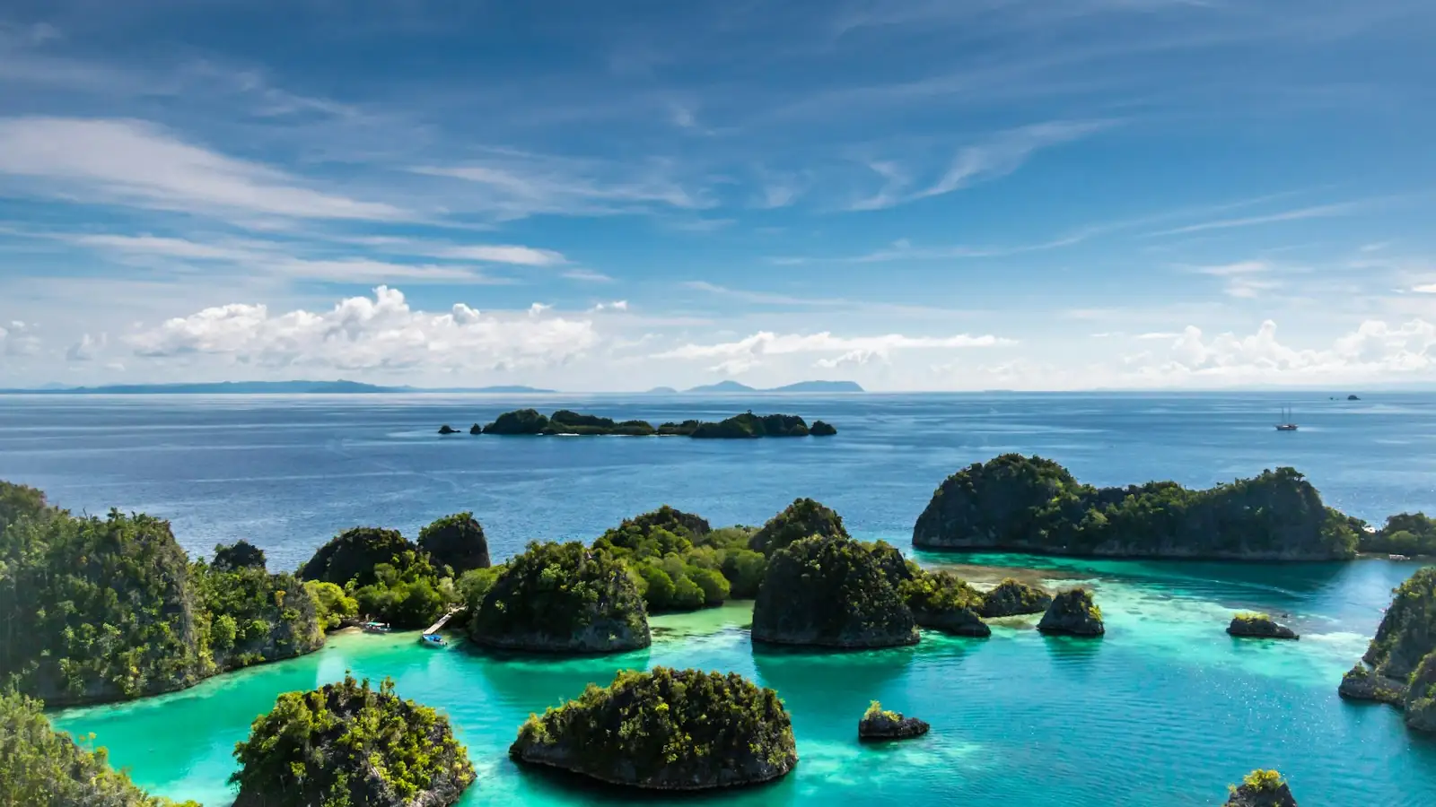 Traditional Indonesian phinisi sailing yacht on calm tropical water